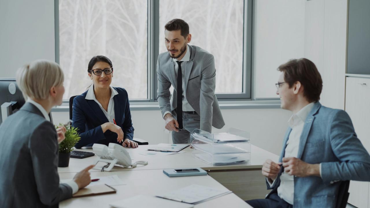 Business professionals collaborating around a conference table.
